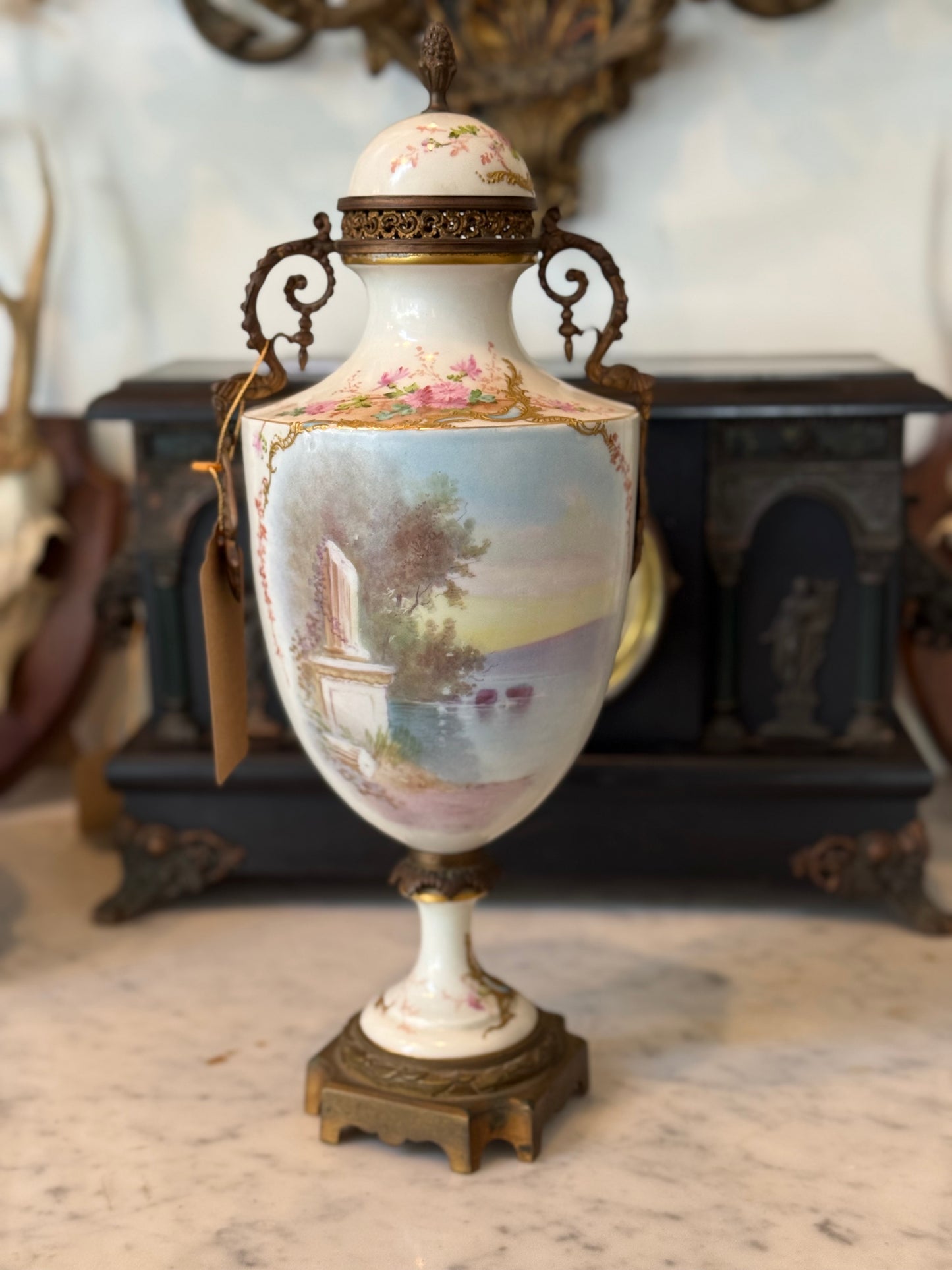 Pair of Antique Hand-Painted Sèvres-Style Porcelain Lidded Urns with Ormolu Mounts