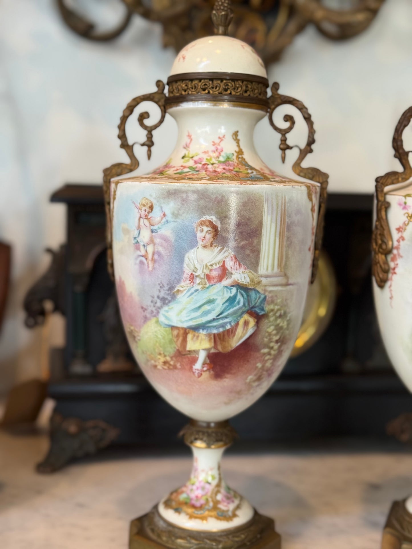 Pair of Antique Hand-Painted Sèvres-Style Porcelain Lidded Urns with Ormolu Mounts