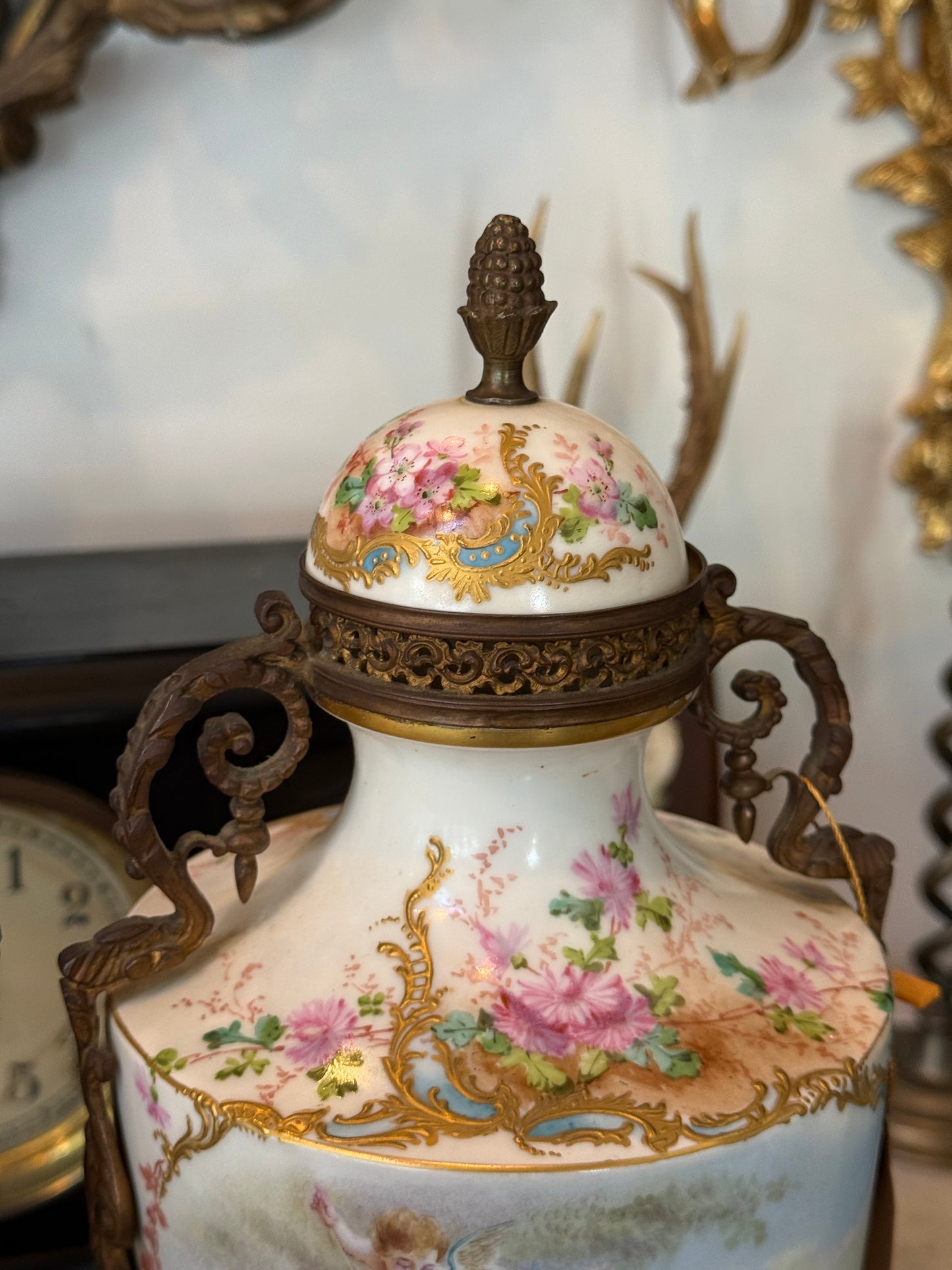 Pair of Antique Hand-Painted Sèvres-Style Porcelain Lidded Urns with Ormolu Mounts
