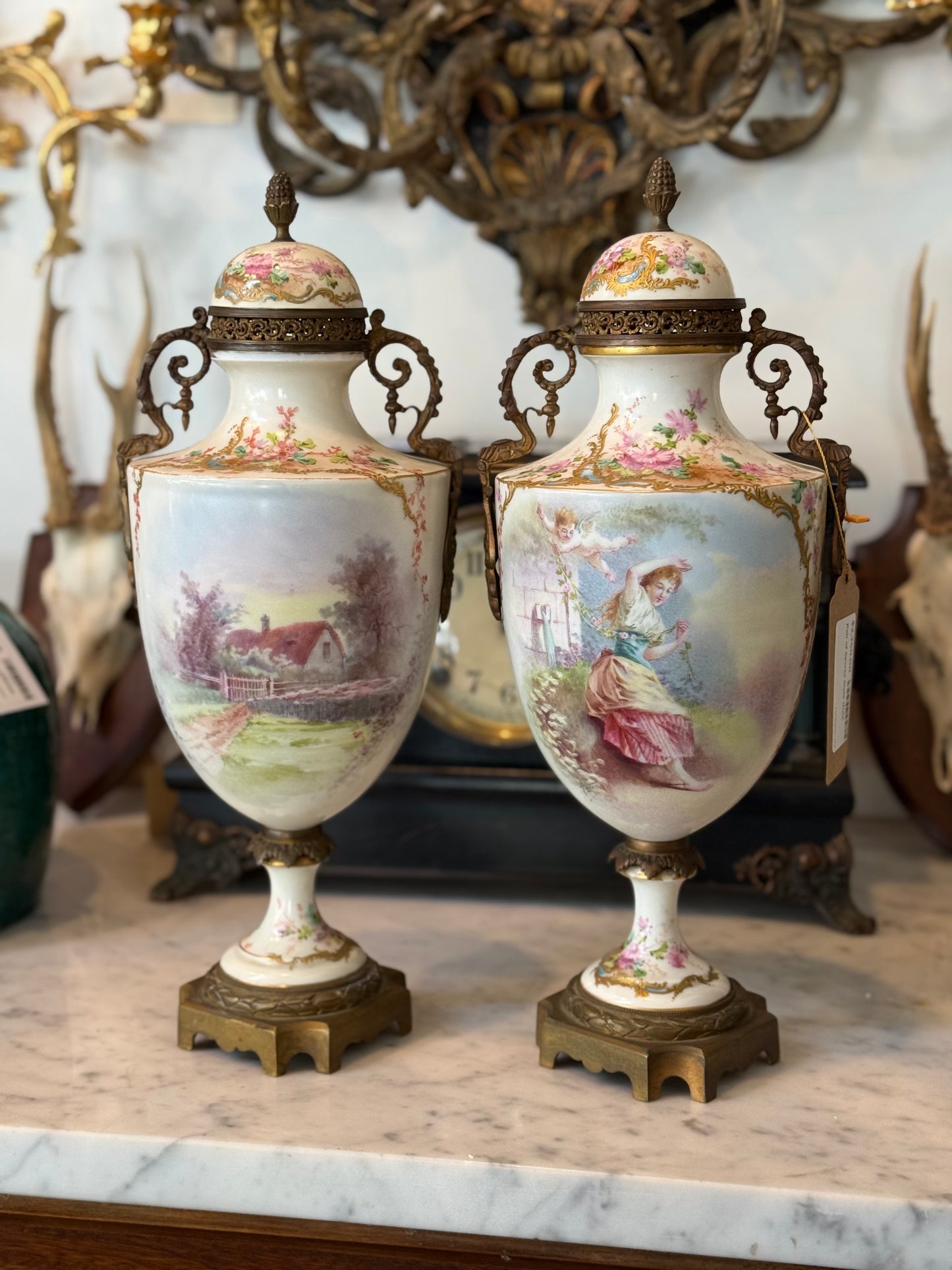 Pair of Antique Hand-Painted Sèvres-Style Porcelain Lidded Urns with Ormolu Mounts
