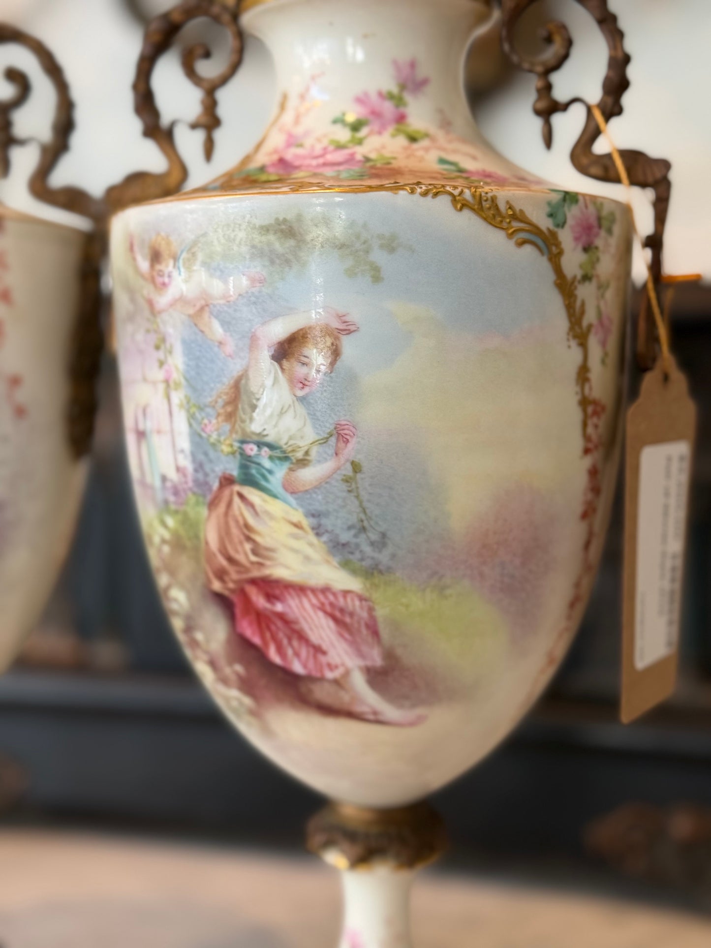 Pair of Antique Hand-Painted Sèvres-Style Porcelain Lidded Urns with Ormolu Mounts