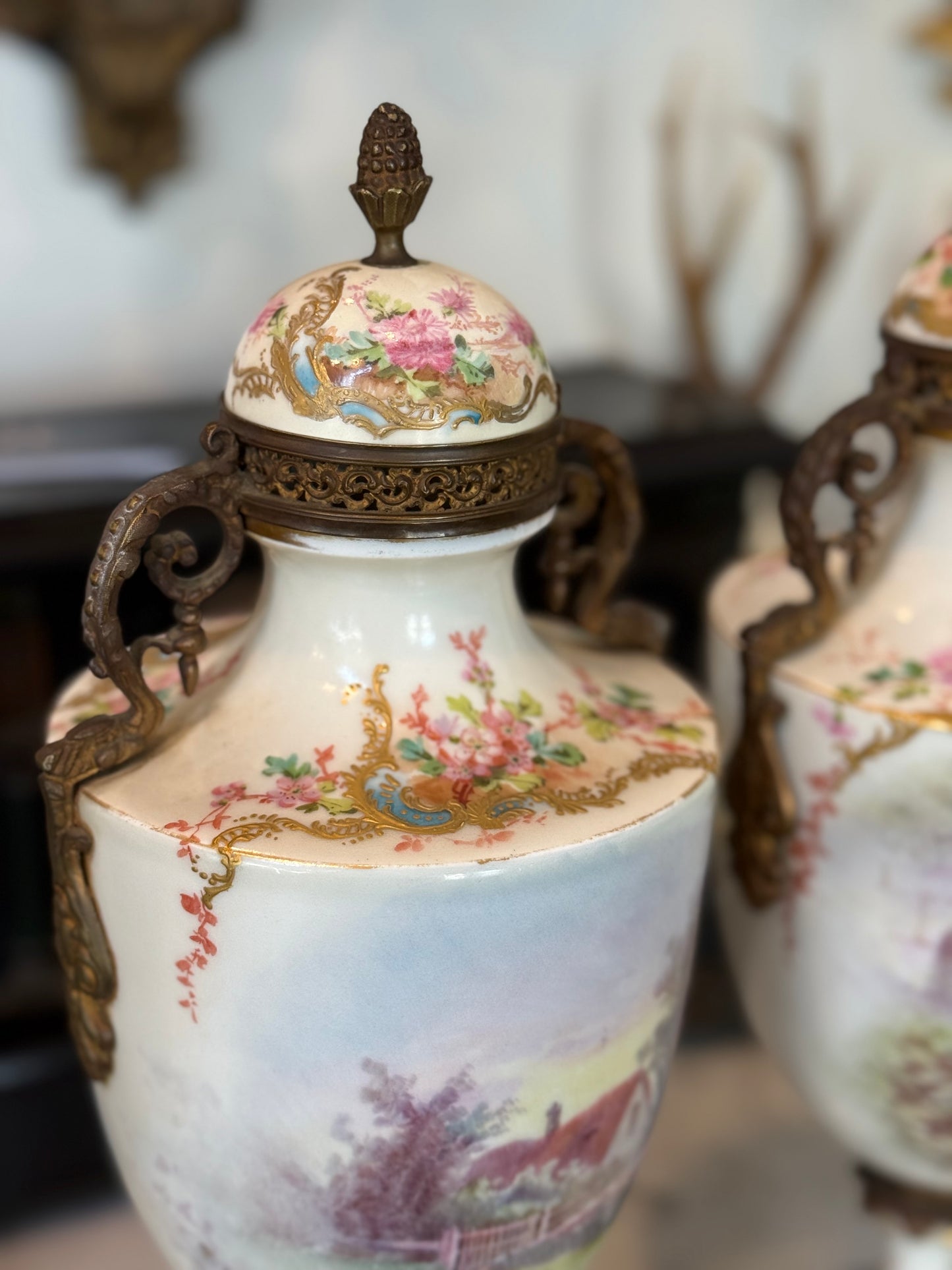 Pair of Antique Hand-Painted Sèvres-Style Porcelain Lidded Urns with Ormolu Mounts
