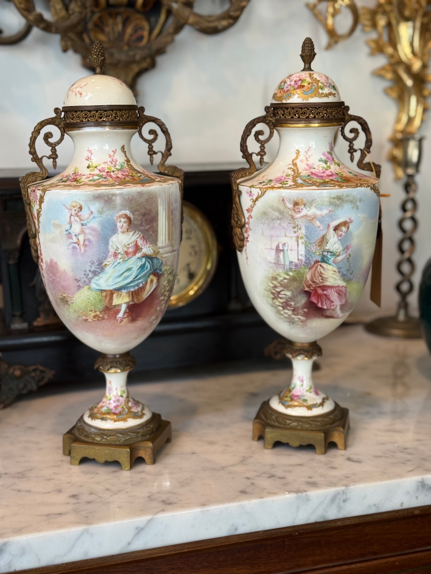 Pair of Antique Hand-Painted Sèvres-Style Porcelain Lidded Urns with Ormolu Mounts